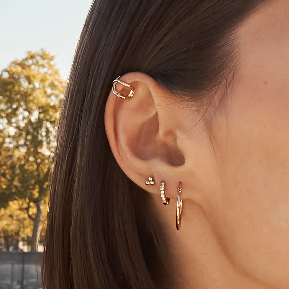 White Topaz Rainbow Huggie Earrings in Gold